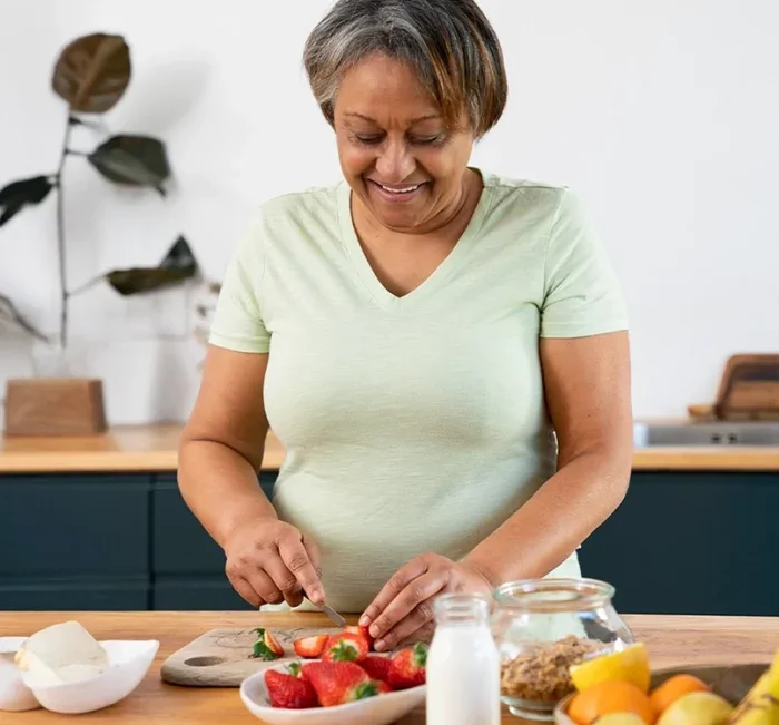 Woman preparing a healthy blood-sugar-friendly meal